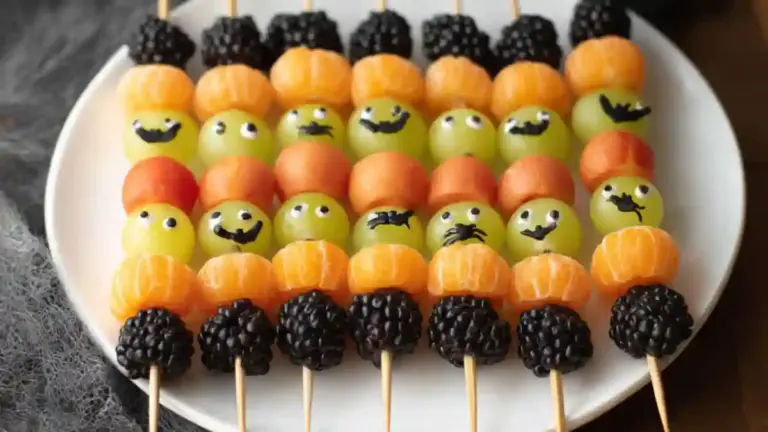 Spooky fruit kabobs decorated for Halloween with fruits and spooky elements