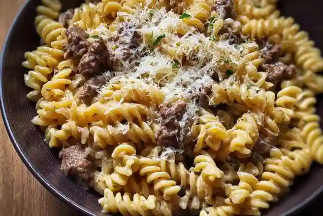 Delicious Beef and Rotini in creamy garlic parmesan sauce served in a bowl