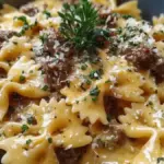 Creamy Parmesan garlic beef bowtie pasta served in a bowl