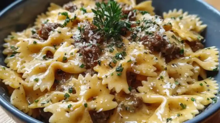 Creamy Parmesan garlic beef bowtie pasta served in a bowl