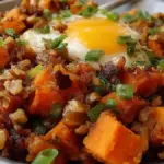 Maple Walnut Sweet Potato Hash served in a bowl with walnuts and maple syrup