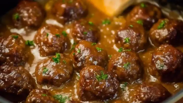 Bowl of Slow Cooker Salisbury Steak Meatballs served with gravy