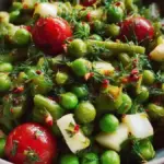 Tangy vegetarian pea salad with vibrant greens and dressing