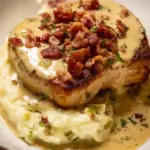 Creamy bacon pork chops served with a side of vegetables