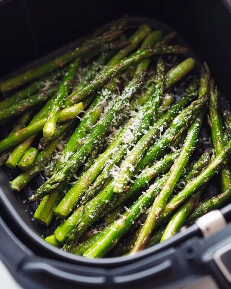 Crispy air fryer asparagus served on a plate, garnished and ready to enjoy