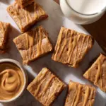 Chewy one-bowl Biscoff blondies with a golden brown top and a rich texture.