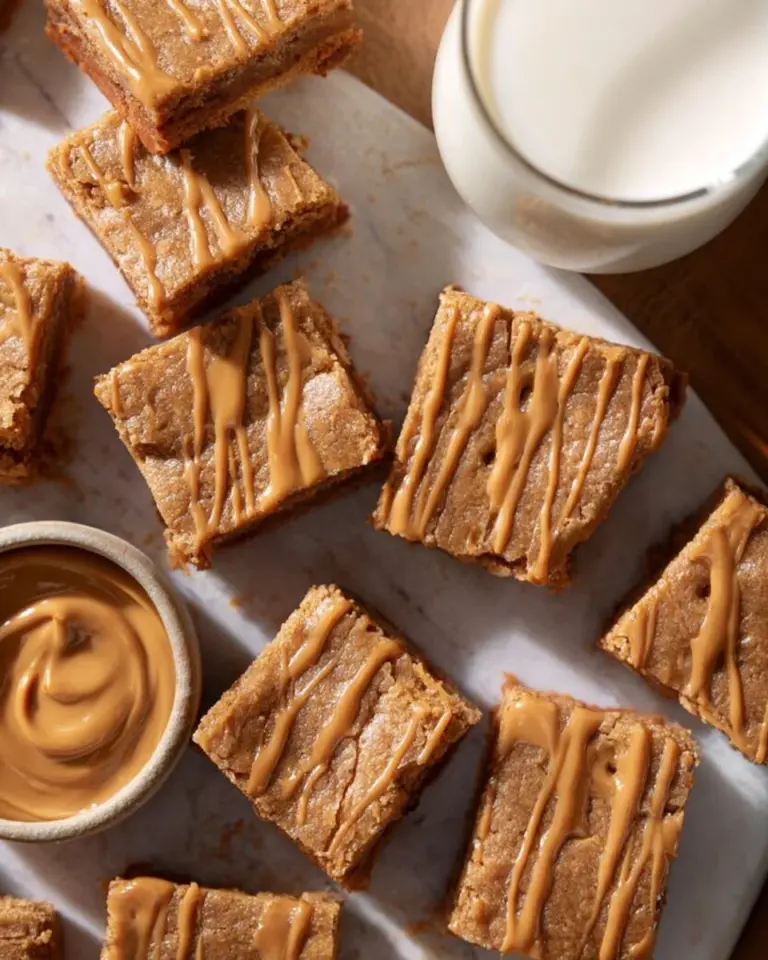 Chewy one-bowl Biscoff blondies with a golden brown top and a rich texture.