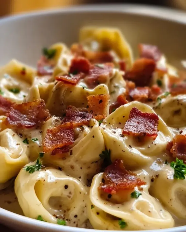 Delicious creamy bacon and cheese tortellini served in a bowl