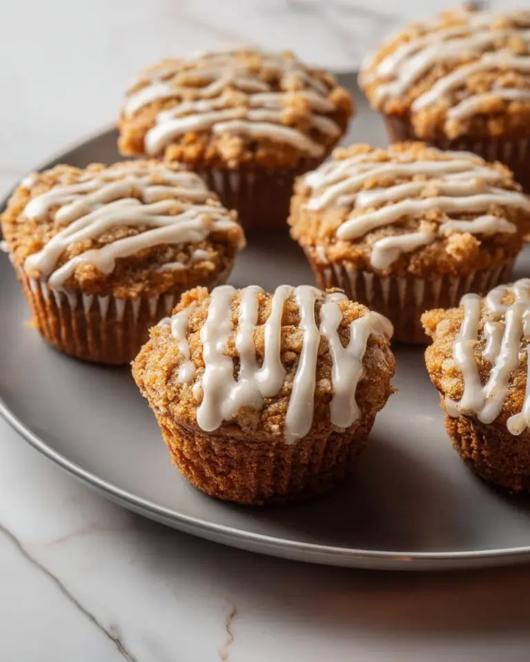 Delicious Eggnog Crumble Muffins topped with crunchy streusel on a holiday table