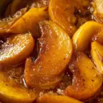 Delicious fried apples served in a bowl, highlighting their golden brown color.