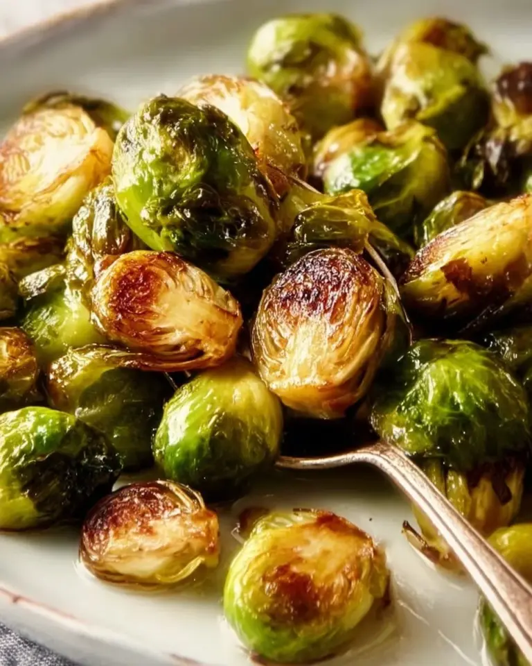 Oven-roasted Brussels Sprouts served in a bowl, crispy and delicious.