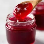 Sweet jellied cranberry sauce served in a dish on a holiday table