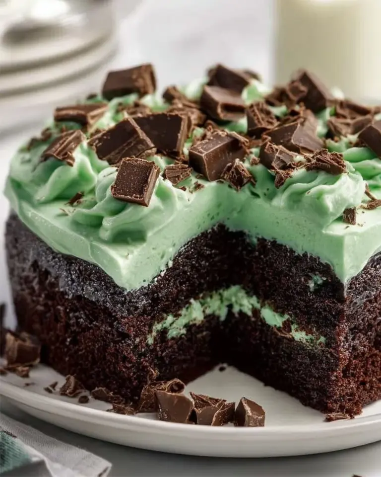 Mint chocolate poke cake with festive St. Patrick's Day decorations.
