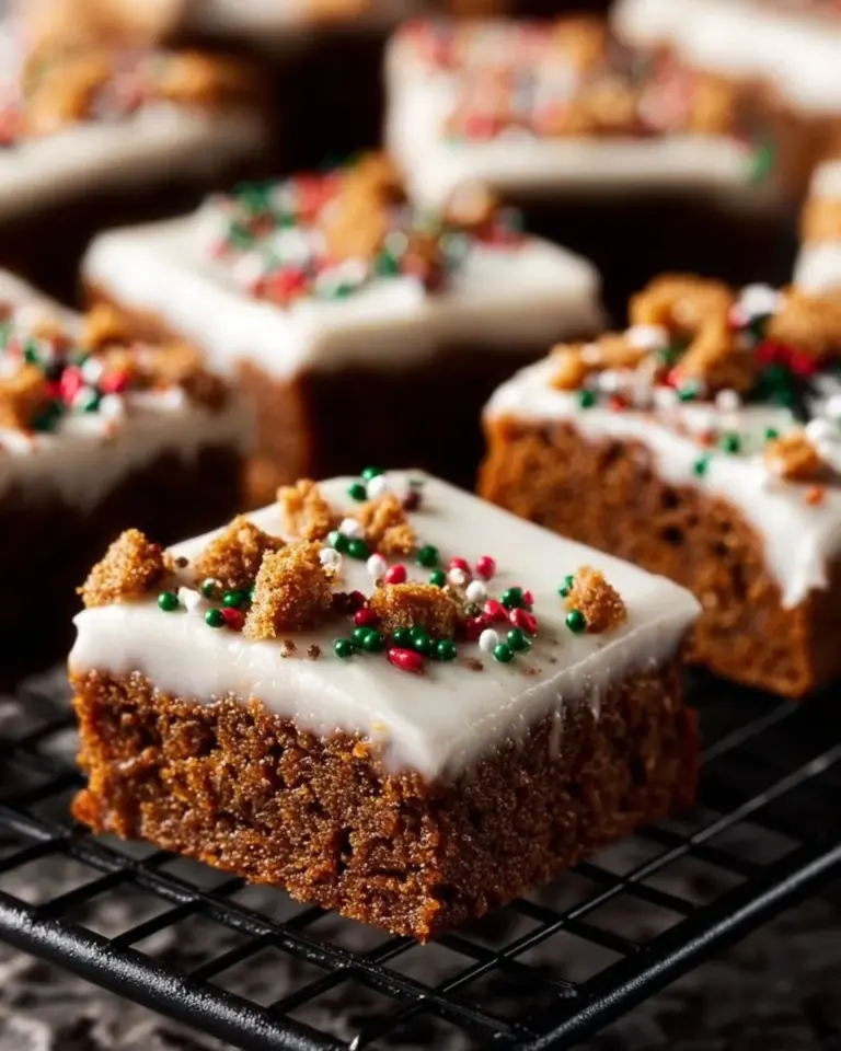 Delicious homemade Gingerbread Cookie Bars topped with frosting and spices