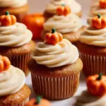 Delicious homemade pumpkin cupcakes topped with cream cheese frosting.