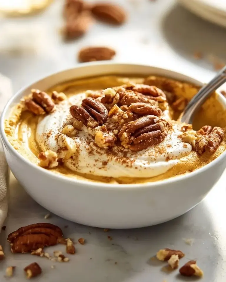 Delicious Pumpkin Pie Greek Yogurt topped with spices and pumpkin seeds