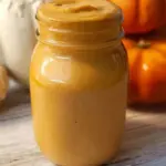 Delicious pumpkin pie smoothie topped with whipped cream and cinnamon.