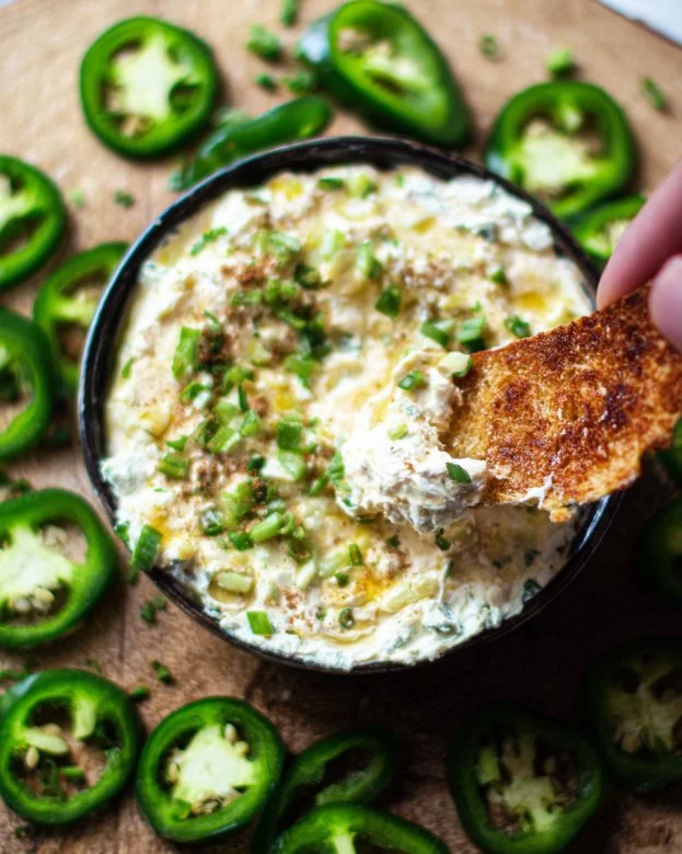 Delicious jalapeno cream cheese dip served in a bowl with tortilla chips