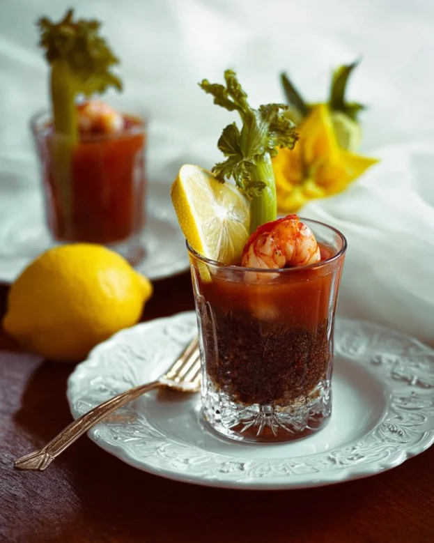 A refreshing Zesty Bloody Mary cocktail garnished with celery and lemon.