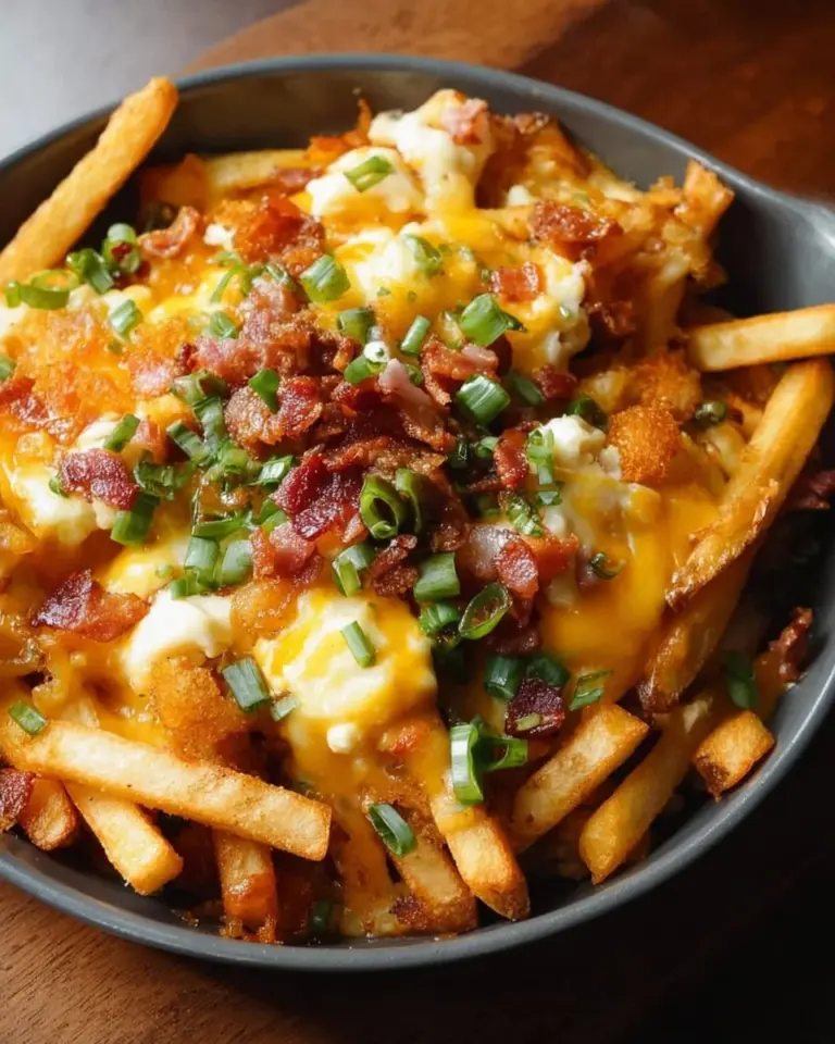 Delicious Breakfast Poutine topped with Hollandaise Sauce for a hearty meal