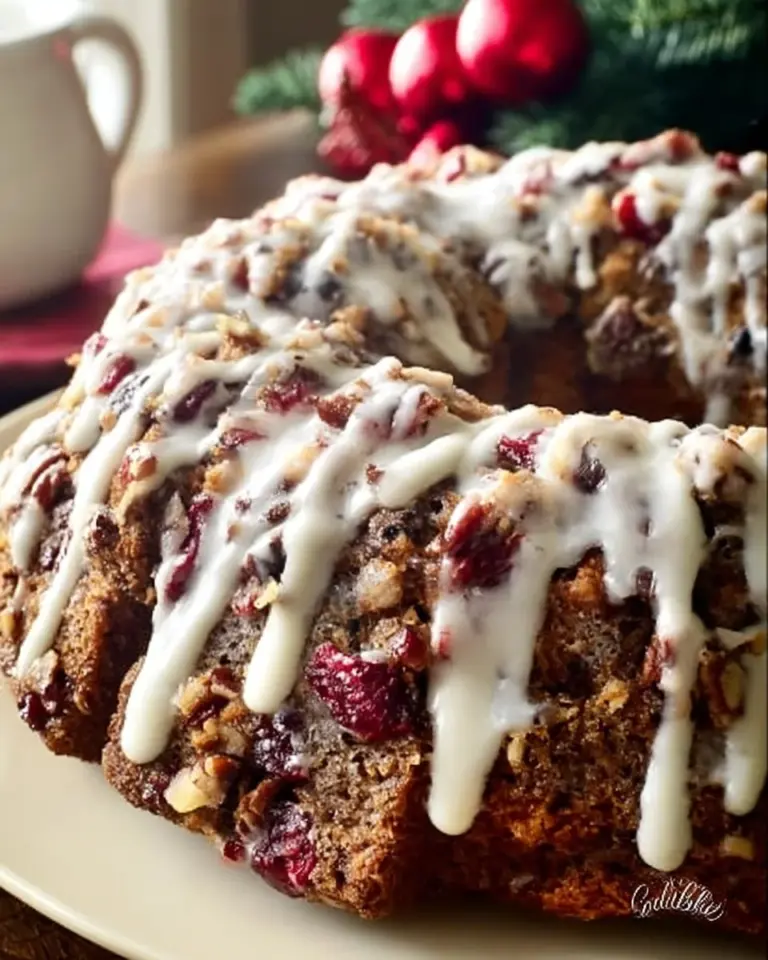 Christmas Cranberry Pecan Coffee Cake topped with pecans and cranberries