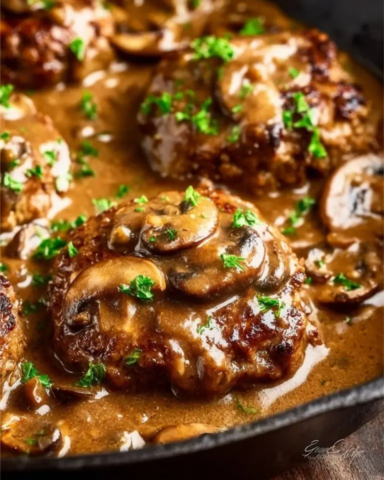 Easy Salisbury steak topped with flavorful mushroom gravy served on a plate