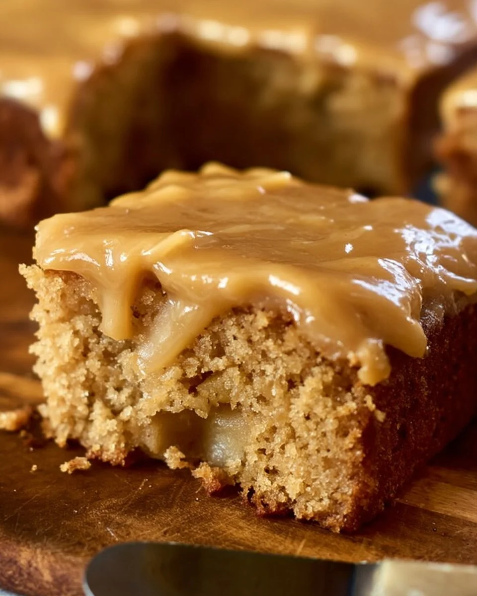 Delicious Spice Apple Cake with Caramel Icing served on a plate