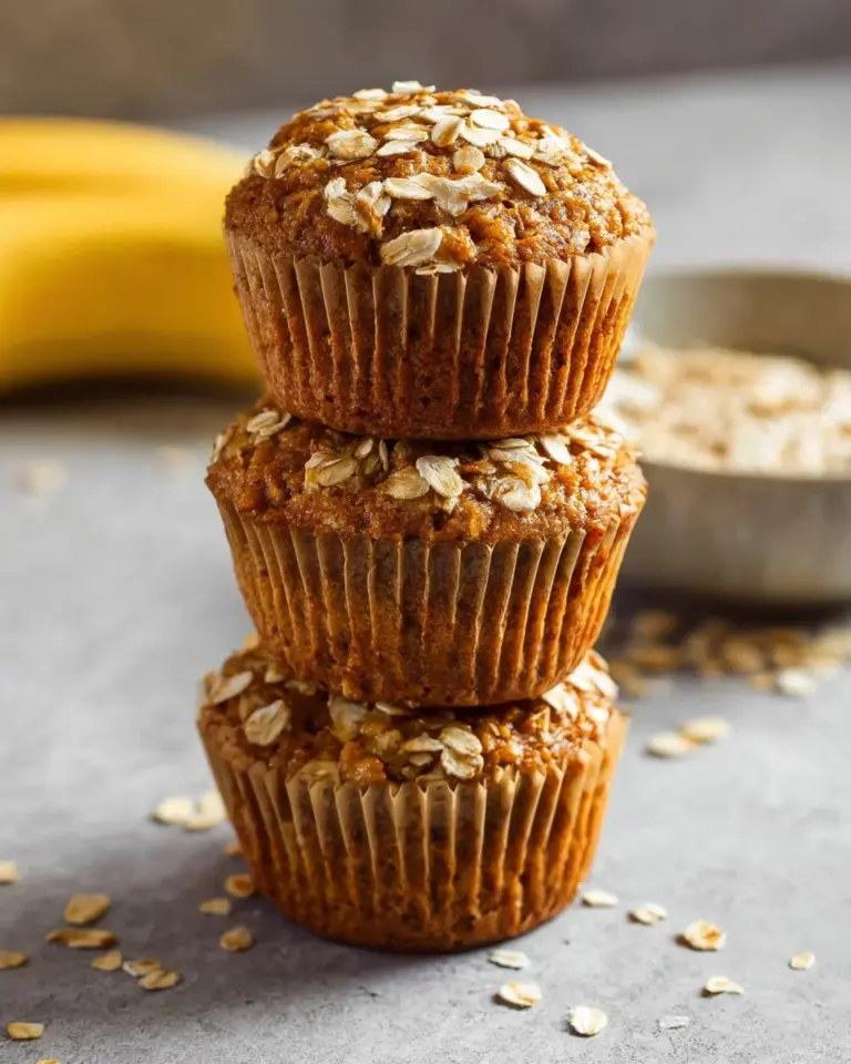 Delicious Banana Oatmeal Muffins on a rustic wooden table