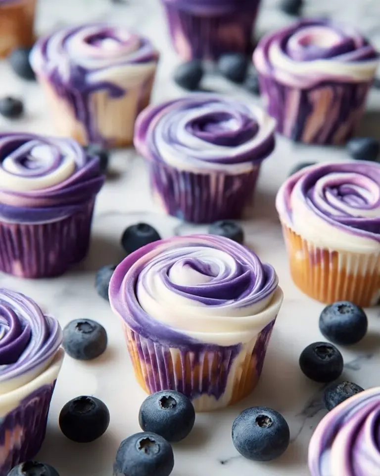 Blueberry swirl yogurt bites with fresh blueberries and yogurt coating