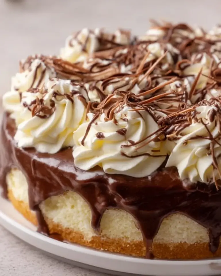 Delicious slice of Nutella Three Milks Cake with creamy frosting