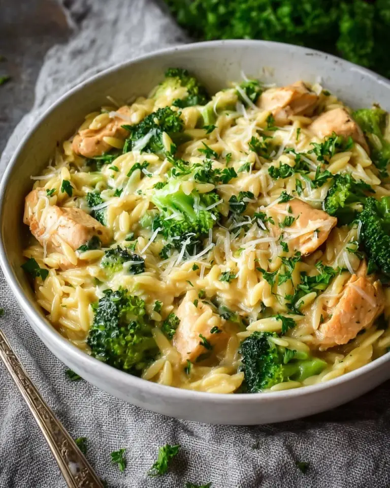 Bowl of Cheesy Chicken Broccoli Orzo with chicken, broccoli, and cheese melted
