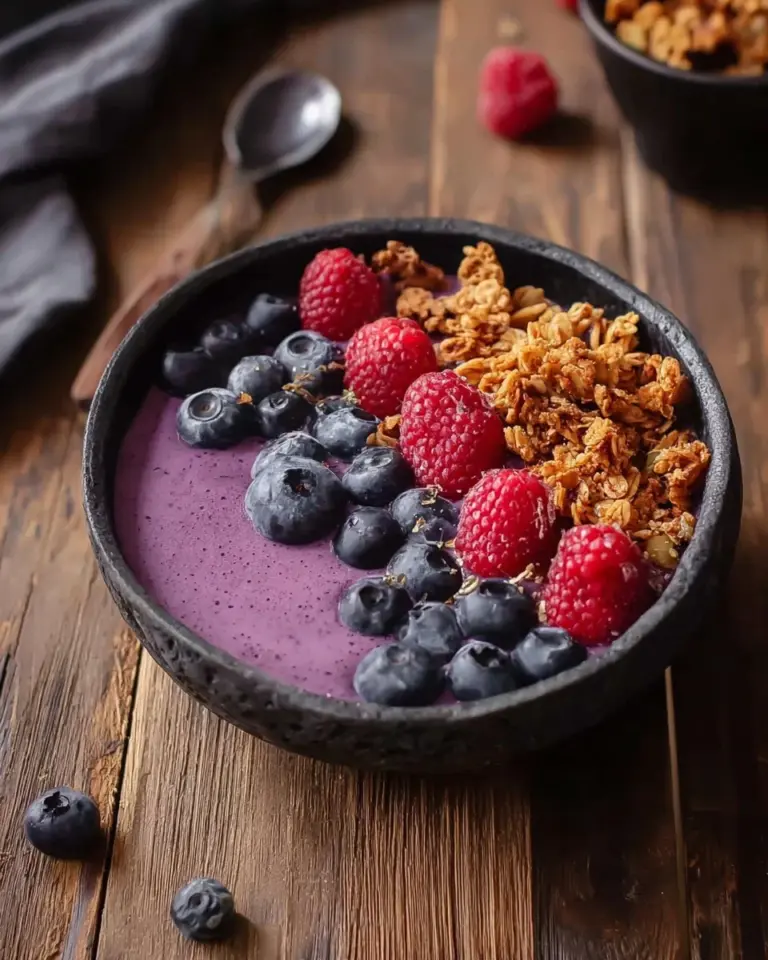 Nutritious smoothie breakfast bowl topped with fresh fruits and nuts