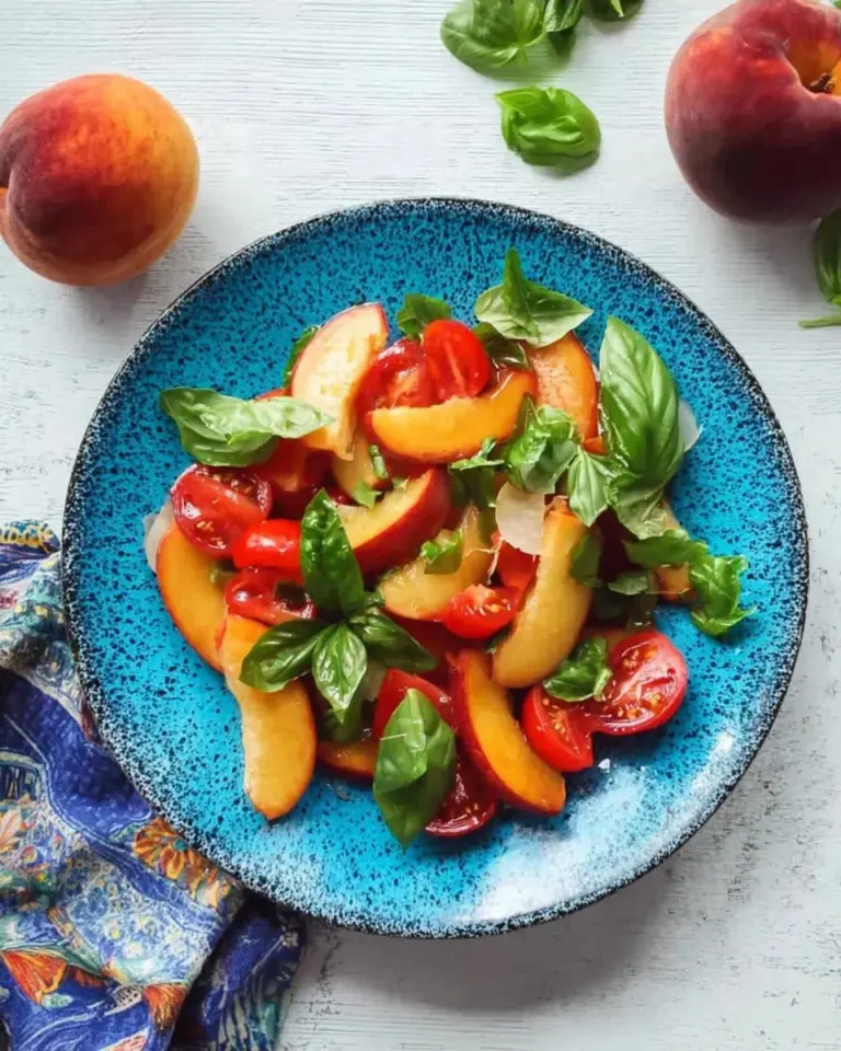 Fresh Tomato Peach Salad with Basil served in a bowl