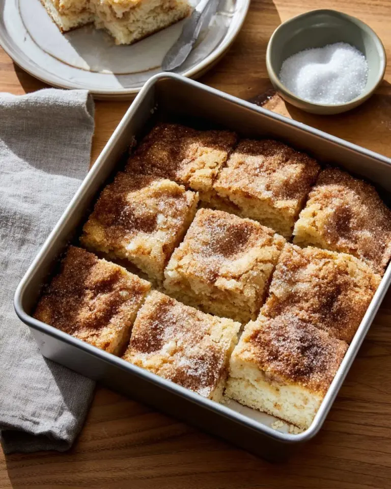 Freshly baked cinnamon sugar butter swim biscuits on a plate