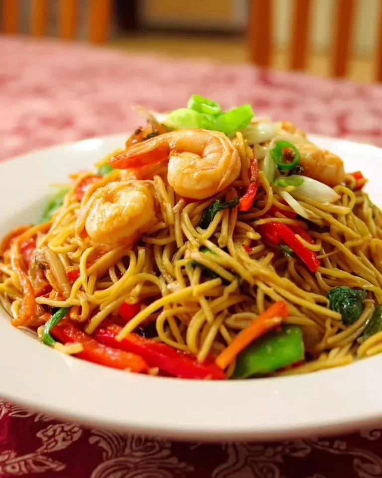 Delicious Filipino Pancit Canton stir-fried egg noodles with vegetables and meat