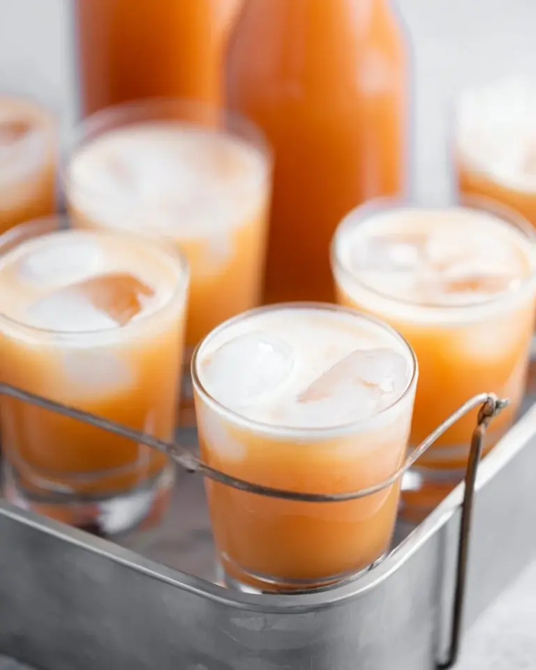 A refreshing glass of homemade Thai Iced Tea with vibrant orange color.
