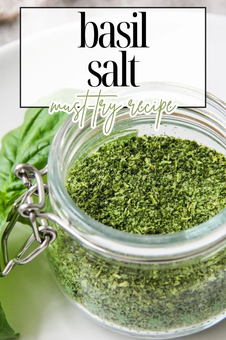A jar of gourmet Basil Salt used for seasoning various dishes